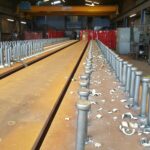 shear studs welded through steel floor deck into beam