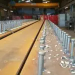 shear studs welded through steel floor deck into beam